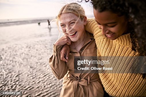 Two happy female friends embracing on the beach Two happy female friends embracing on the beach
