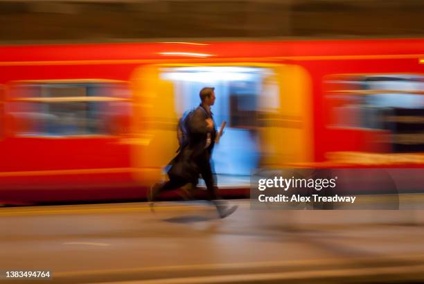 running for a train - london train stock pictures, royalty-free photos & images