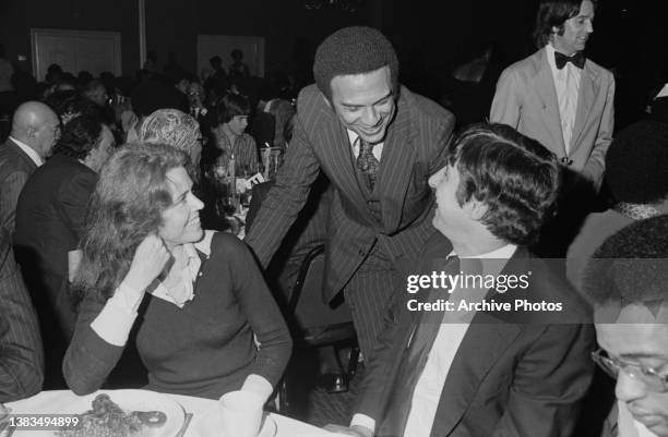 American politician Andrew Young , the United States Ambassador to the United Nations, chats with actress Jane Fonda and her husband, activist Tom...