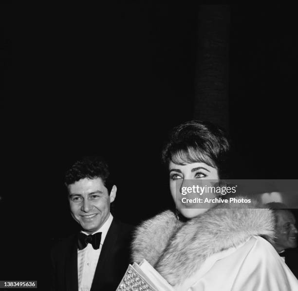 Actress Elizabeth Taylor and her husband, singer and actor Eddie Fisher attend the Hollywood premiere of the film 'Suddenly, Last Summer', Los...