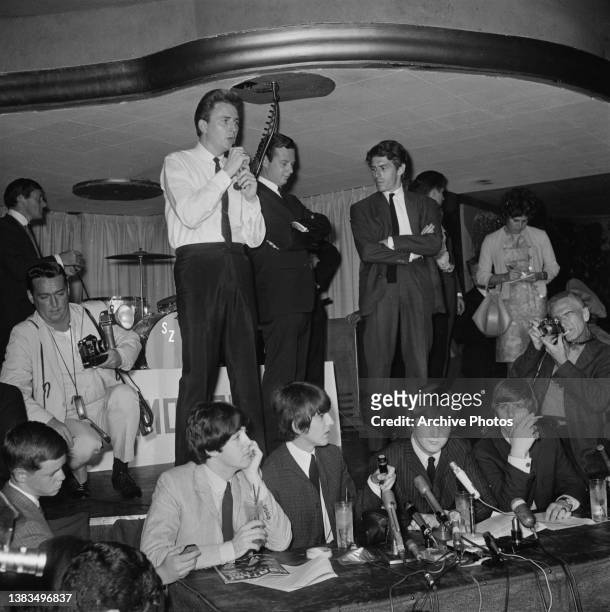 English rock group the Beatles hold a press conference at Cinnamon Cinder in Los Angeles, California, before their performance at the Hollywood Bowl,...