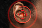 Close-up of black woman's ear with source of pain