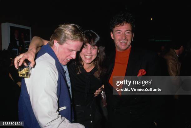 From left to right, American actors Gary Busey, Julie Carmen and Ray Sharkey attend the screening of the Showtime television miniseries 'The Neon...