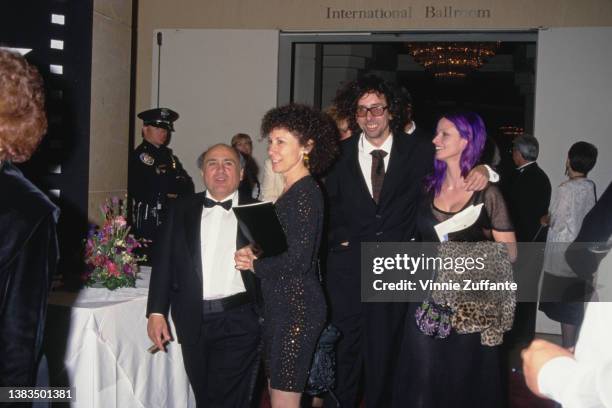 From left to right, American actor Danny DeVito, his wife, actress Rhea Perlman, film director Tim Burton and his partner, actress Lisa Marie attend...