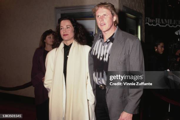 American actor Gary Busey and Australian actress Belinda Bauer attend the premiere of the film 'Defending Your Life' at the Mann Bruin Theatre in...