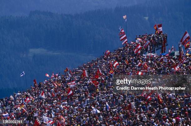 Austrian fans watch the racing from the grandstand during the Formula One Austrian Grand Prix on 26th July 1998 at the A1-Ring, Spielberg, Austria.
