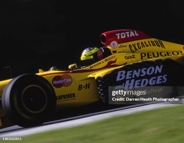 Ralf Schumacher of Germany drives the Benson & Hedges Total Jordan Grand Prix Peugeot Jordan197 Peugeot V10 during practice for the Formula One...