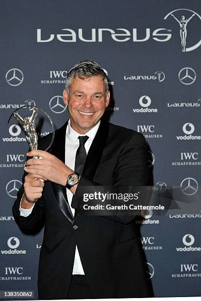 Golfer Darren Clarke with his Laureus World Comeback of the Year trophy poses in the press room at the 2012 Laureus World Sports Awards at Queen...