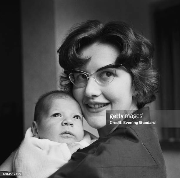 Rosalie Monbiot, the wife of businessman Raymond Geoffrey Monbiot, with their baby son George Monbiot, UK, 9th March 1963. George later became an...