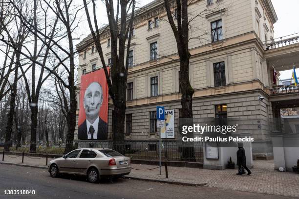 Poster against Putin on building near Russia embassy on March 8, 2022 in Riga, Latvia. As NATO-member, Latvia's border with Russia will receive...