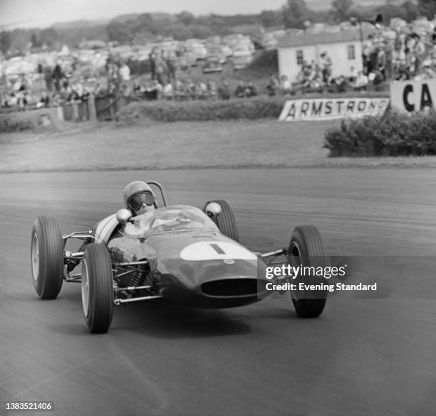 British racing driver Peter Arundell in a Team Lotus Lotus 22 car during the Formula Junior event at the 27th RAC Tourist Trophy Race at Goodwood...