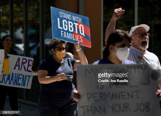 People protest in front of Florida State Senator Ileana Garcia's office after the passage of the Parental Rights in Education bill, dubbed the "Don't...