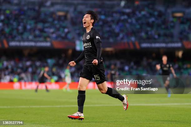 Daichi Kamada of Eintracht Frankfurt celebrates after scoring their team's second goal during the UEFA Europa League Round of 16 Leg One match...