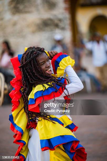 colombian dancer performing in the main street - colombian ethnicity stock pictures, royalty-free photos & images