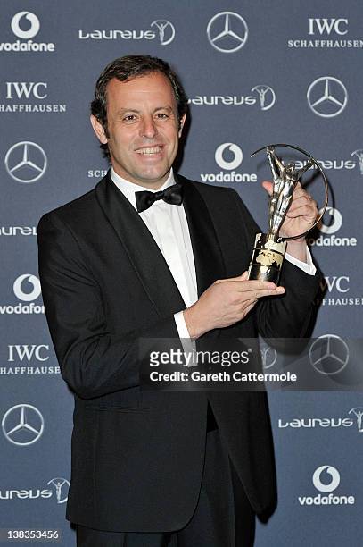 Sandro Rosell,Barcelona Chairman poses with the Laureus World Team of the Year trophy in the press room at the 2012 Laureus World Sports Awards at...