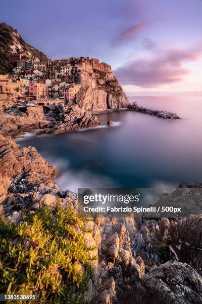 manarola sunset fine art,scenic view of sea against sky during sunset,manarola,la spezia,italy - liguria stockfoto's en -beelden