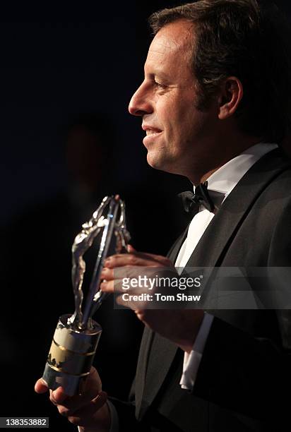 Sandro Rosell,Barcelona Chairman poses with the Laureus World Team of the Year trophy in the press room at the 2012 Laureus World Sports Awards at...