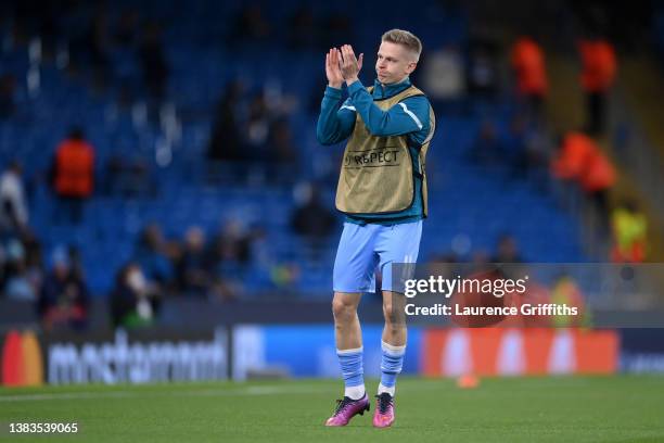 Oleksandr Zinchenko of Manchester City interacts with the crowd ahead of the UEFA Champions League Round Of Sixteen Leg Two match between Manchester...