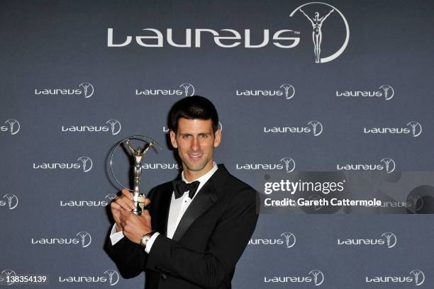 Tennis Player Novak Djokovic poses with his Laureus World Sportsman of the Year trophy in the press room at the 2012 Laureus World Sports Awards at...