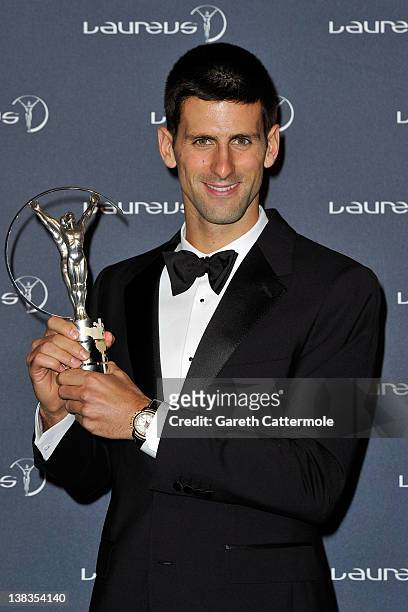 Tennis Player Novak Djokovic poses with his Laureus World Sportsman of the Year trophy in the press room at the 2012 Laureus World Sports Awards at...