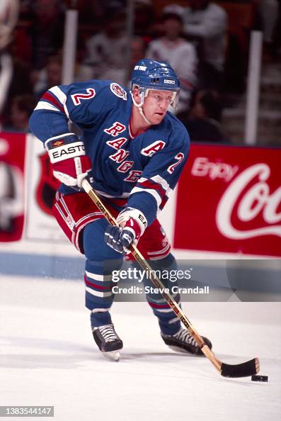 Brian Leetch, of the New York Rangers, rushing the puck out of the ...