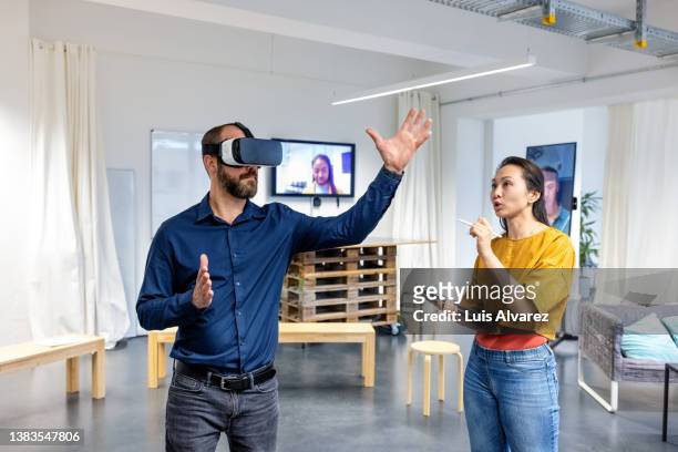 business team testing the new metaverse in office - プロトタイプ ストックフォトと画像
