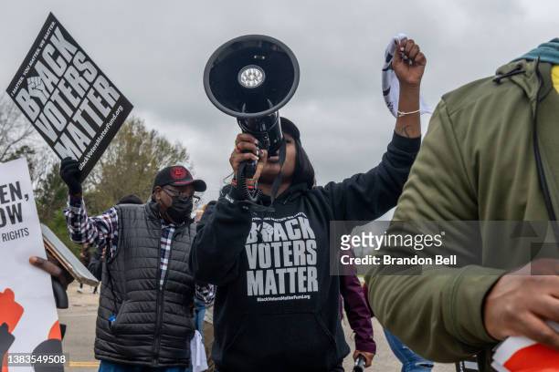 Munique Liggens chants during the Black Voters Matter's 57th Selma to Montgomery March on March 09, 2022 in Selma, Alabama. People gathered alongside...