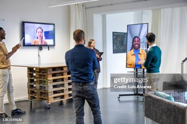 professionals applauding after a successful meeting - virtual brainstorming stock pictures, royalty-free photos & images