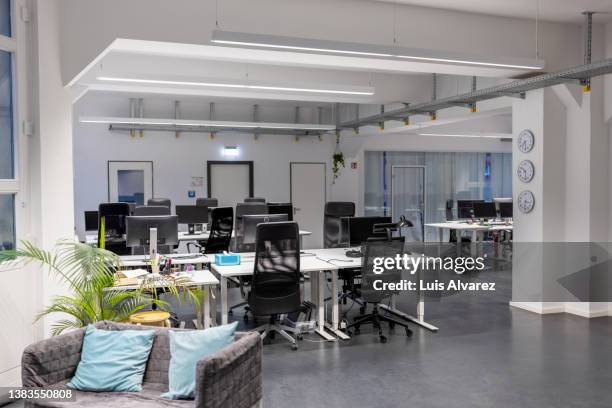 spacious open plan office interior - open space office stock-fotos und bilder