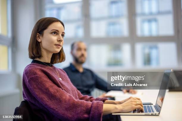 business professionals paying attention to the presentation - conference table top stock pictures, royalty-free photos & images