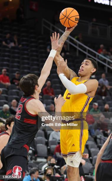 Jalen Graham of the Arizona State Sun Devils shoots against Maxime Raynaud of the Stanford Cardinal during the first round of the Pac-12 Conference...