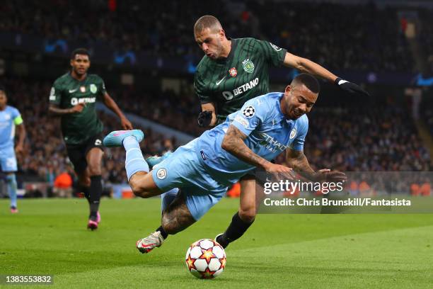 Gabriel Jesus of Manchester City is fouled by Islam Slimani of Sporting CP during the UEFA Champions League Round Of Sixteen Leg Two match between...