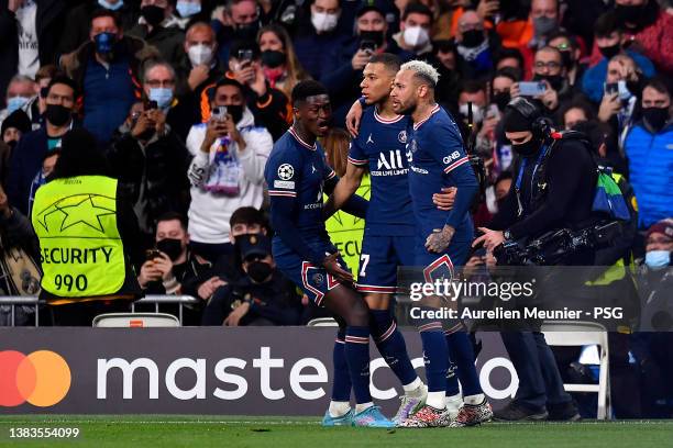 Kylian Mbappe of Paris Saint-Germain is congratulated by teammates Neymar Jr and Nuno Mendes after scoring during the UEFA Champions League Round Of...