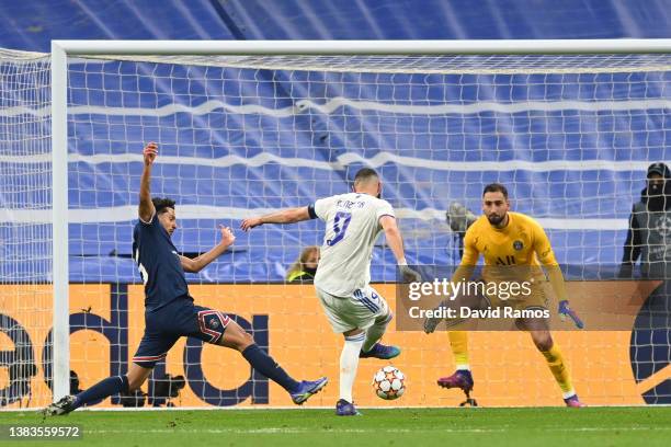 Karim Benzema of Real Madrid scores their team's first goal past Marquinhosn and Gianluigi Donnarumma of Paris Saint-Germain during the UEFA...