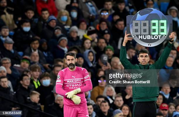 Scott Carson of Manchester City is substituted on to replace team mate Ederson during the UEFA Champions League Round Of Sixteen Leg Two match...