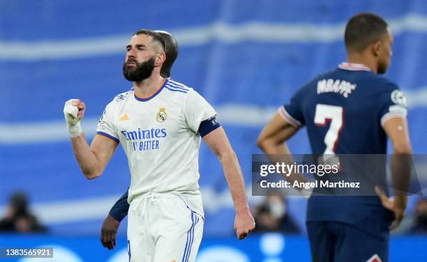 Karim Benzema of Real Madrid celebrates their sides second goal during the UEFA Champions League Round Of Sixteen Leg Two match between Real Madrid...