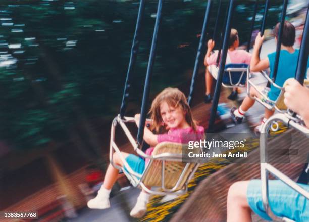 happy child having fun at vintage amusement park 1990s style family photo - nostalgie photos et images de collection