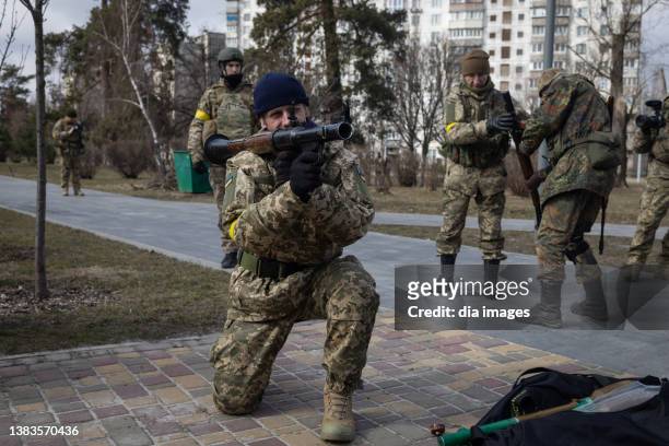 Members of the Territorial Defence Forces learn how to use weapons during a training session on March 9, 2022 in Kyiv, Ukraine.