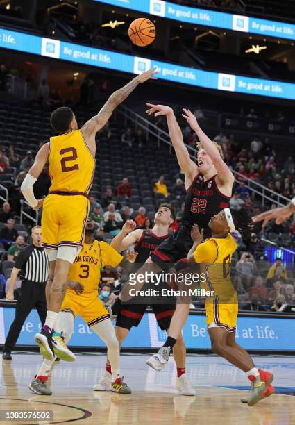 James Keefe of the Stanford Cardinal hits a game-winning shot against Jalen Graham of the Arizona State Sun Devils as time expires in their...