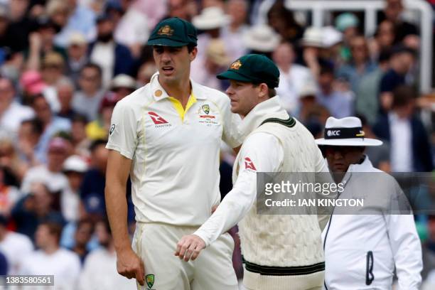 Australia's Pat Cummins and Australia's Steven Smith discuss tactics on day five of the second Ashes cricket Test match between England and Australia...