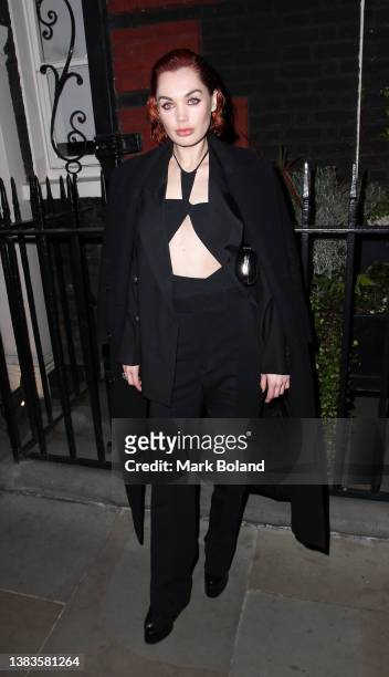 Poppy Corby-Tuech arrives at dunhill's Pre-BAFTA filmmakers dinner & party on March 09, 2022 in London, England.