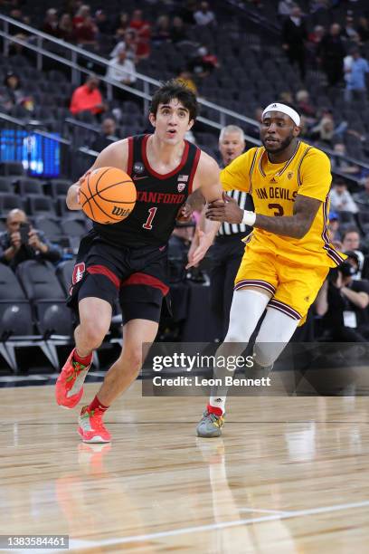 Isa Silva of the Stanford Cardinal handles the ball against Marreon Jackson of the Arizona State Sun Devils during the first round of the Pac-12...