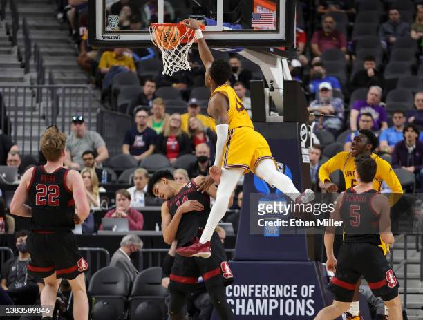 Kimani Lawrence of the Arizona State Sun Devils is fouled as he dunks against Spencer Jones of the Stanford Cardinal during the first round of the...