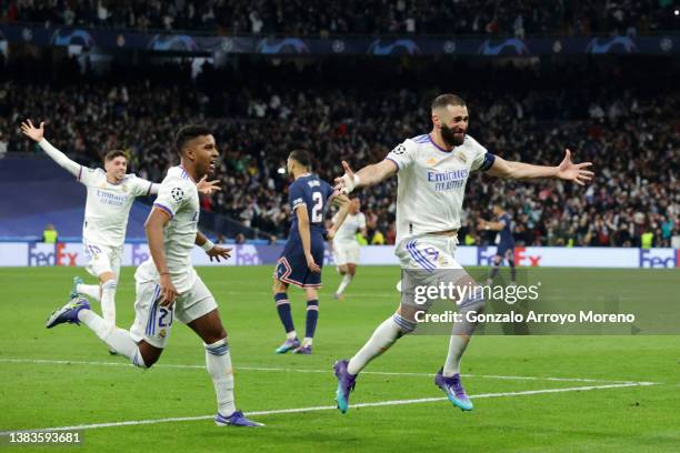 Karim Benzema of Real Madrid celebrates with teammate Rodrygo after scoring their team's third goal and his hat-trick during the UEFA Champions...