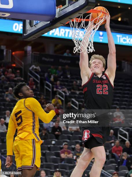 James Keefe of the Stanford Cardinal goes up for a dunk against Jay Heath of the Arizona State Sun Devils during the first round of the Pac-12...