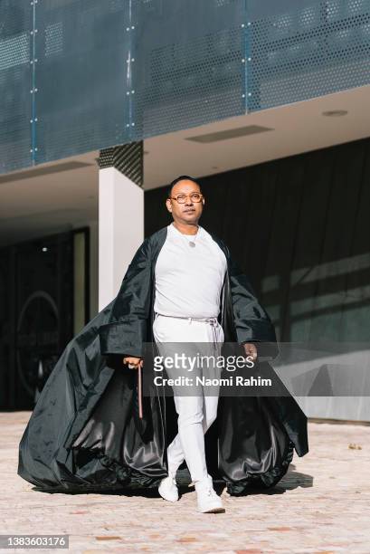 Shiva Singam wearing a custom made cape at Melbourne Fashion Festival 2022 on March 09, 2022 in Melbourne, Australia.
