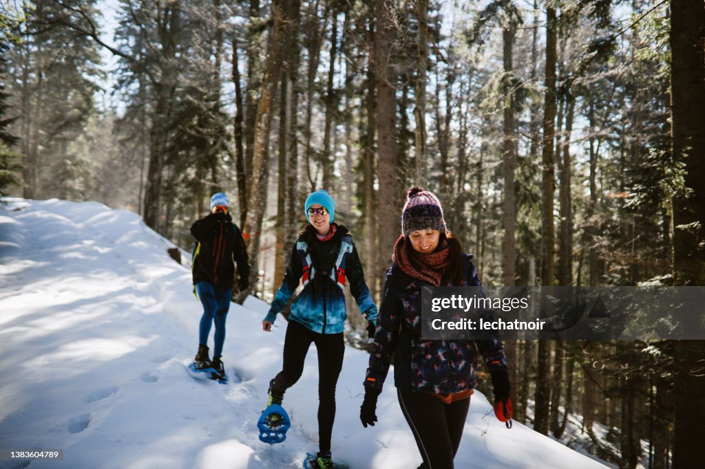 Snowshoeing through the mountain forest