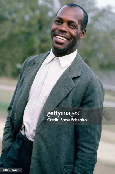 Portrait of American actor Danny Glover as he poses outdoors, Los Angeles, California, 1990.