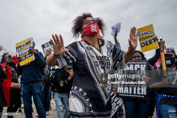 Marchers dance during the Black Voters Matter's 57th Selma to Montgomery march on March 09, 2022 in Selma, Alabama. People gathered alongside...