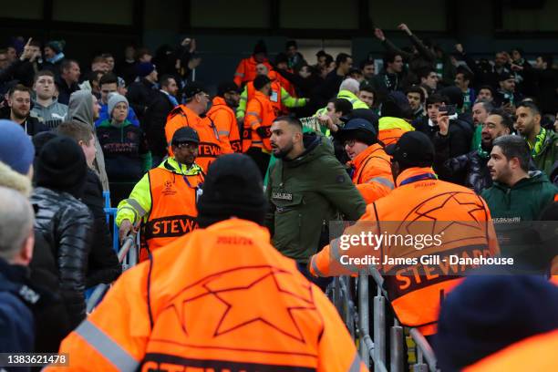 Violence breaks out between Sporting CP and Manchester City supporters during the UEFA Champions League Round Of Sixteen Leg Two match between...